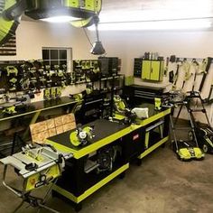 a room filled with lots of green and black workbench sets on top of tables