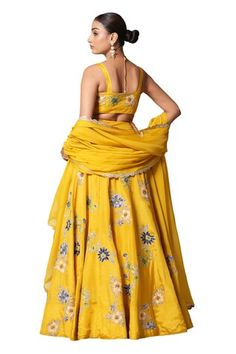 Empire mustard yellow lehenga with an attached cancan, floral appliques highlighted with silver zari, nakshi and sequins. Comes with matching silk padded blouse and scalloped organza dupatta. - Aza Fashions Yellow Floral Embroidery Sharara For Reception, Reception Yellow Floral Embroidered Sharara, Yellow Floral Embroidered Sharara For Reception, Yellow Floral Embroidered Lehenga For Diwali, Fitted Yellow Lehenga With Floral Embroidery, Yellow Cotton Silk Lehenga With Cutdana, Yellow Silk Choli With Cutdana Detail, Yellow Semi-stitched Art Silk Lehenga, Semi-stitched Yellow Slub Silk Lehenga