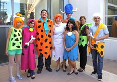 a group of people dressed up in costumes