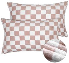 two pink and white checkered pillows next to each other