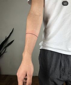 a person with a small tattoo on their arm