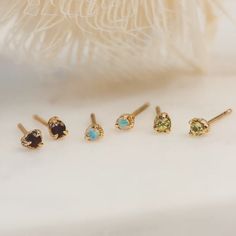 14k Gold Birthstone Studs shown on white backdrop. Three pairs: red garnet, blue opal and green peridot Second Piercings, Second Piercing, Birthstone Earrings, Birthstone Earring, Fine Earrings, Try On, Gemstone Earrings, A Month, Jewelry Care