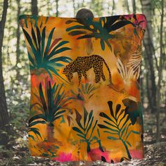 a blanket with an image of a giraffe in the jungle