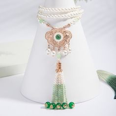 Material: Imitation pearl Color: Green Phoenix Long Necklace Fashion Element: Tassel, Chain Style: Antique Style Green Pearl Necklaces With Pearl Pendant, Green Pearl Necklace With Pearl Pendant, Green Pearl Necklace With Pendant, Elegant Necklace With 108 Beads For Gift, Elegant Necklace With 108 Beads Pendant, Costume Jewelry Pearl Necklace With Pearl Pendant, Bohemian Pearl Pendant Necklace, Elegant Wedding Necklace With 108 Beads, Pearl Pendant Beaded Necklace