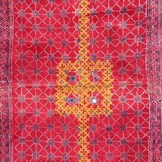 Rare old silk embroidered and resist dye hand block printed wedding shawl or 'Maleer' or 'Odhani', usually attributed to dowry work as part of a groom's attire during a wedding in Tharparkar area of Sindh, Pakistan. This example dates to the mid 20th century, and most likely made by one of the Lohana or Meghwar groups that inhabit this area. The condition is excellent, and the silk embroidery is very fine, done in soft, muted colors and expertly executed. The corners of the shawl have been embellished with orange beads and multicolored metal discs, and the body has been decorated with mica mirrors as protection to the wearer from the evil eye. This really is a fine example of a lost art of an embroidery tradition which no longer is practised in the area. The dimensions are 71" x 46.5" (180 Traditional Embroidered Raw Silk Fabric For Puja, Vintage Festive Dupatta With Traditional Patterns, Ceremonial Chanderi Embroidered Fabric With Motifs, Raw Silk Embroidered Fabric With Traditional Patterns For Puja, Festive Vintage Dupatta With Traditional Patterns, Vintage Embroidered Fabric With Traditional Patterns For Festivals, Vintage Silk Dupatta For Festivals, Silk Vintage Dupatta For Festivals, Vintage Festive Dupatta With Motifs