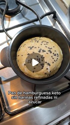 a pan filled with food sitting on top of a stove