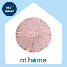 a pink pillow with the words best seller at home on it's front and bottom corner