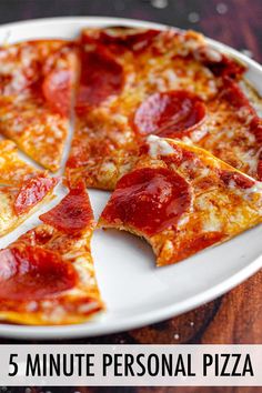 slices of pepperoni pizza on a white plate