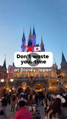 people standing in front of a castle with the words don't waste you time at disney japan