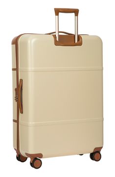 Full-grain Tuscan leather trim adds understated elegance to a spacious yet lightweight suitcase crafted from durable polycarbonate for reliable protection. Four fully rotating wheels make for effortless navigation through crowds and to your destination. Protected water-repellent zip closure with TSA-approved locks
 Telescoping pull handle; top and side carry handles Interior zip pockets Polycarbonate with leather trim Imported Men's Furnishings Classic Travel Cases With Leather Trim, Classic Rectangular Travel Luggage, Classic Beige Rectangular Luggage, Protect Water, Lightweight Suitcase, Vacation Tops, Spinner Suitcase, Girls Shoes Kids, Winter Sneakers