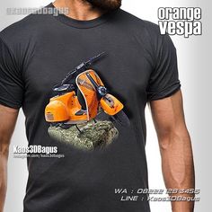 the man is wearing an orange vespa t - shirt