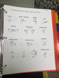 a binder with instructions on how to use the hand symbols for communication approaches and tips