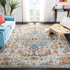 a living room with a blue couch and rug