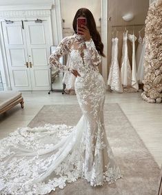 a woman taking a selfie in her wedding dress