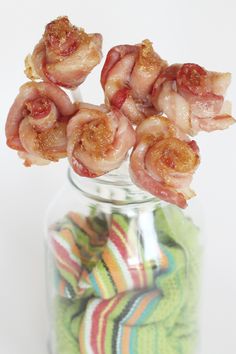 bacon wrapped shrimp sticks in a glass jar