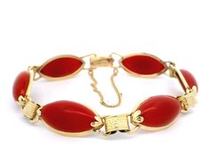 -Stone(s)- (6) Synthetic Coral - Marquise Cabochon - Bezel Set - Ox Blood red Color - 17.73 x 9.77mm (approx.) Material: 13k-14k Yellow Gold Weight: 16.64 Grams Length: Will comfortably fit 7" wrist (measured on wrist) Closure: Plush clasp w/ safety chain Width: 11.38mm (0.44") (approx.) Thickness: 5.10mm (approx. - rise off wrist) Condition: Shows some wear, original finish & patina preserved. Excellent overall condition. Stock Number: JO-16045099 Formal Cabochon Bracelet Jewelry, Oval Cabochon Bracelets For Formal Occasions, Red Polished Bracelets For Formal Occasions, Vintage Red Jewelry With Polished Finish, Red Antique Bracelet For Formal Occasions, Antique Red Bracelet For Formal Occasions, Formal Oval Costume Jewelry Bracelets, Formal Oval Costume Jewelry Bracelet, Vintage Red Gemstone Bracelets