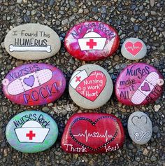 painted rocks with words and pictures on them are arranged in the shape of heart shapes