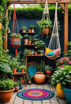 an outdoor patio with potted plants and hammock