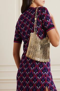 In the '60s, Rabanne debuted his collection of Space Age dresses featuring the same metallic details that can be found on this '1969' chainmail bag. Like a piece of jewelry, it's pieced together from scores of gold-tone discs to create a slinky shape. Double up the strap for a shorter drop. Space Age Dress, Chain Mail, Vegan Shoes, Paco Rabanne, Space Age, Net A Porter, Crochet Bag, Women Collection, Luxury Design