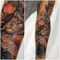 a cat with flowers on it's arm and the other half of its leg