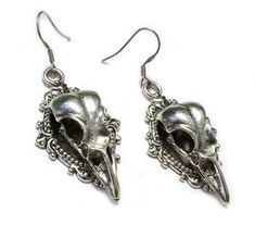 These new handmade earrings feature:    Antiqued Silver Plated filigree frames, raven skulls and stainless steel earring hooks    Earrings measures 2 1/4" tall and 1" wide    Matching headpiece and necklace are available in our storeIf you have any questions, please feel free to let us know. Gothic Silver Earrings, Collectible Silver Gothic Jewelry, Gothic Earrings Victorian, Silver Gothic Collectible Jewelry, Adjustable Gothic Skull Earrings, Nevermore Raven, Raven Jewelry, Antique Silver Earrings, Crow Bird