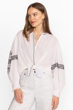 The Irenie Kivi Blouse is crafted from breathable, 100% cotton fabric. Featuring a split V-neckline with gathers at the neck and sleeves, this lightweight blouse is finished with intricate placement embroidery and ruffling at the cuffs. Pair with classic denim and fashion sneakers for a weekend look with impeccable style. Johnny Was Women's Kivi Blouse in White, Size XS, Cotton/Denim Spring V-neck Peasant Top With Blouson Sleeves, Spring Split Neck Top For Daywear, Spring V-neck Relaxed Fit Peasant Top, Spring V-neck Peasant Top With Relaxed Fit, Cotton Peasant Top V-neck, Cotton Peasant Top With V-neck, Peasant Style Cotton V-neck Blouse, Peasant Style Cotton V-neck Top, Chic V-neck Peasant Top Relaxed Fit