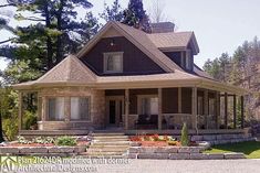 a large house sitting in the middle of a forest