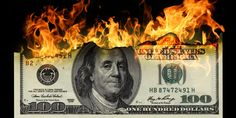 a hundred dollar bill is on fire with the words $ 100 in front of it