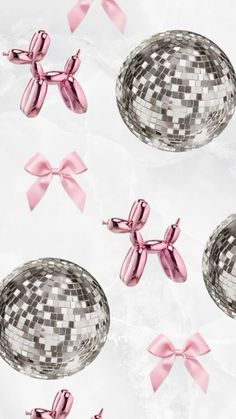 pink bows and silver disco balls on white paper with bowknots in the background