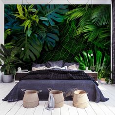 the bedroom is decorated with tropical plants and wicker baskets