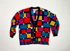 1990s multicolor and super lightweight and silky cardigan style jacket. This jacket has a loose fit, light shoulder pads, and buttons up the center front Label: Peter Popovitch Origin: Made in USA Material: 100% polyester (it's a silky lightweight matte fabric) Condition: Excellent vintage condition. No holes, rips, or stains.  Measurements: Size: Medium Bust: 44 inches Length: 26 inches (from base of neck to hem) Sleeve length: 20 inches All of my vintage items are at least 20 years old which m Retro Multicolor Buttoned Cardigan, Retro Multicolor Cardigan With Buttons, Multicolor Retro Cardigan With Buttons, Vintage Multicolor Cardigan With Buttons, Cardigan Colorful, 90s Cardigan, Jacket Blouse, Matte Fabric, Cardigan Style