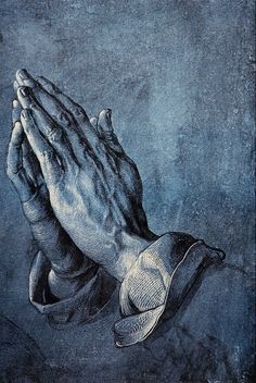 an image of two hands folded in prayer