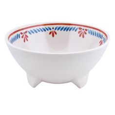 a white bowl with red and blue designs on it