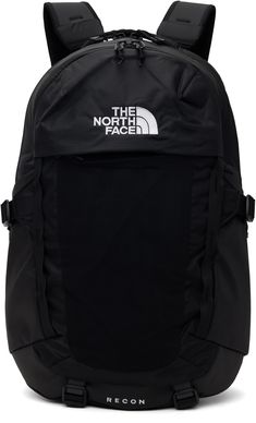 Water-resistant non-PFC DWR-coated recycled nylon canvas backpack in black. · Padded carry handle · Adjustable padded shoulder straps · Press-release sternum strap · Reflective webbing loop at sides and shoulder straps · Logo and text embroidered at face · Zip pockets and stretch mesh pocket · Patch pocket and cinch strap at sides · Cinch straps at base · Zip laptop compartment at padded FlexVent™ back panel · Two-way zip closure · Patch and zip pockets at interior · Recycled nylon duck canvas l Black North Face Backpack, The North Face Backpack, North Face Recon, Canvas Backpack Men, Aesthetic Backpack, Duck Canvas, Black North Face, Canvas Backpack, North Face Backpack