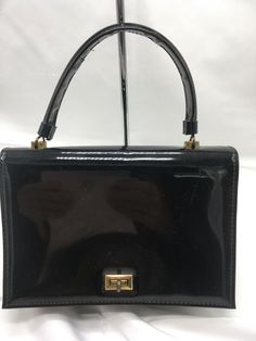 Vintage JR Florida Julius Resnick Black Patent Handbag Purse USA PLEASE READ FULL DESCRIPTION and VIEW ALL PHOTOS Some Wear, Scuffs, Scratches or Marks to Body Corners Edges Strap Brass Tone Hardware - Scratches, Wear Also Some Wear and Marks to Interior Wiped Clean No Odor Actual Measurements 9” Length 6” Height 4" Width 4.5” Carrying Handle Please Contact me before you Purchase if you have Question about Payment Please make Payment within 48 Hours close of Sale. Otherwise, item will be re-list Handbag Purse, Vintage Clothing, Vintage Outfits, Top Handle Bag, Florida, Handbags, Closet, How To Wear, Quick Saves