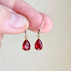 Garnet Earrings, January Birthstone, Tiny Dark Red Teardrop Earrings in Gold or Silver, Pear Shape Drop Earrings, Garnet Jewelry for Women These elegant minimal tiny earrings feature dark red Garnet teardrop gemstones prong set in your choice of gold filled or sterling silver. The vivid garnet pear cut drops are suspended from lever back ear wires in the finish of your choice. These are great choice for small, delicate and simple yet elegant earrings to wear virtually anywhere. Ideal gift for a Red Teardrop Crystal Earrings, Red Drop Earrings For Gift, Red Teardrop Earrings For Gifts, Red Drop Crystal Earrings As Gift, Single Pear-shaped Teardrop Earring As Gift, Red Teardrop Hypoallergenic Earrings, Red Hypoallergenic Teardrop Earrings, Red Hypoallergenic Teardrop Jewelry, Red Teardrop Earrings As A Gift