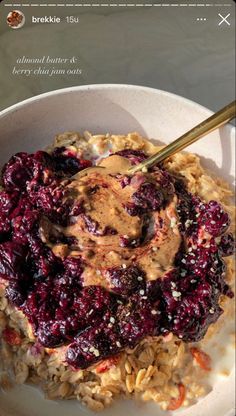 a white bowl filled with oatmeal and fruit