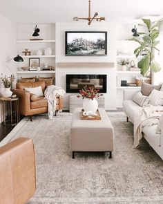 a living room filled with furniture and a fire place