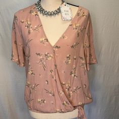 This Beautiful Pink Rose Women's Blouse Is Perfect For Any Occasion. The V-Neckline And Short Sleeves Provide A Comfortable And Stylish Fit For All Body Types. The Blouse Is Made Of High-Quality Rayon Material That Is Both Soft And Durable. The Pink Color And Rose Theme Add A Touch Of Femininity To Any Outfit. This Blouse Is Available In A Regular Size L And Is Perfect For Any Woman Looking To Add A Basic, Yet Stylish Piece To Her Wardrobe. Chic Pink V-neck Top For Spring, Feminine V-neck Tops For Brunch, Summer V-neck Top With Rose Print, Chic Rose Print Tops For Summer, Chic Summer Tops With Rose Print, Feminine V-neck Top For Day Out, Rose Print Top For Summer Day Out, Summer Rose Print Top For Day Out, Pink Floral Print V-neck Blouse