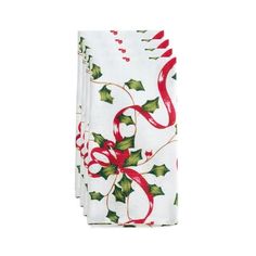 three christmas napkins with holly designs on them