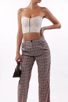 Mauve plaid trouser pants High waisted Wide leg Front button closure with zipper fly Side Pockets Belt loops Hand wash Model: 5'9.5" bust 32C waist 24 hips 34.5 dress 2-4 Model wearing size S/M Hypeach Style Number: BP031-MAU Discover sophistication in our SoHo Plaid Trousers in Mauve. These high-waisted trousers feature a wide leg, front button closure with zipper fly, and convenient side pockets. Designed for chic versatility with belt loops and crafted for comfort, these pants elevate your st