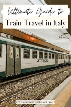 a train traveling down tracks with the words ultimate guide to train - travel in italy