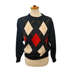 This is a vintage black argyle crewneck sweater with red and white, from Sweater Bee. It is made from wool blend. Condition - excellent, clean, pre-owned condition. Light pilling. I estimate this to be a medium. There is no size tag in the sweater. Please check measurements. Pit-pit 20.5" Waist 20" Sleeve 21.5" Length 23" VA Checked Winter Argyle Pattern Crew Neck Sweater, Classic Argyle Pattern Sweater For Fall, Casual Argyle Pattern Crew Neck Sweater, Black Argyle Pattern Crew Neck Sweater, Black Argyle Crew Neck Sweater, Retro Wool Crew Neck Top, Retro Argyle Pattern Crew Neck Sweater, Retro Crew Neck Sweater With Argyle Pattern, Retro Crew Neck Argyle Sweater