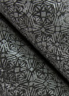 black and silver fabric with an intricate design