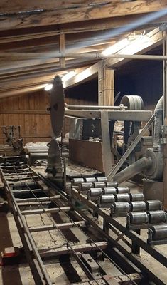 the inside of a building that has pipes and machinery in it, all lined up