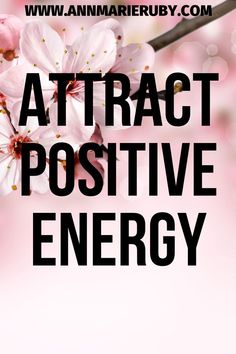 the words attract positive energy are in black and white letters with pink flowers on them