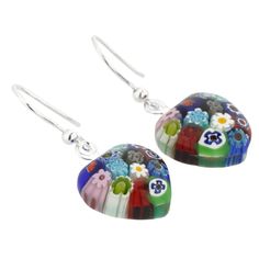 These exquisite sterling silver Venetian Murano Glass earrings are made using the most famous and unique glass-making technique- Millefiori (a thousand flowers)- which has become a trademark of Murano Glass craftsmanship. Each earring features a mosaic of colorful stylized flowers in rich colors that immediately catches the eye. These Murano millefiori earrings are feminine and versatile and will look great with any outfit. Pair them with a Millefiori pendant in silver frame from our extensive M Elegant Multicolor Heart Earrings Gift, Elegant Multicolor Heart Earrings For Gift, Elegant Multicolor Round Flower Earrings, Murano Glass Earrings, Murano Glass Jewelry, Glass Making, Venetian Glass, Genuine Leather Bags, Elegant Accessories