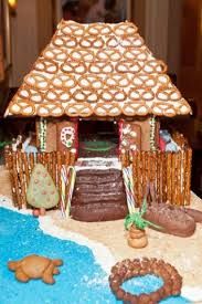 a gingerbread house decorated with icing and decorations