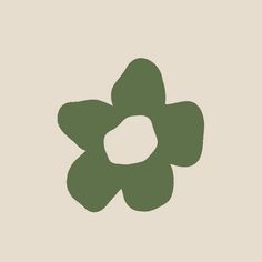 a green flower on a beige background with the letter o in it's center