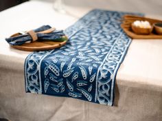 a table topped with a blue and white cloth